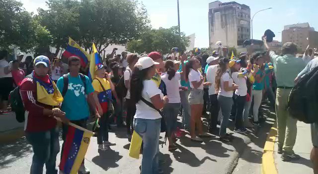 Venezuela: Protesters sing the National Anthem in front of the picket line of the National Guard in Juan Griego, Nueva Esparta state.