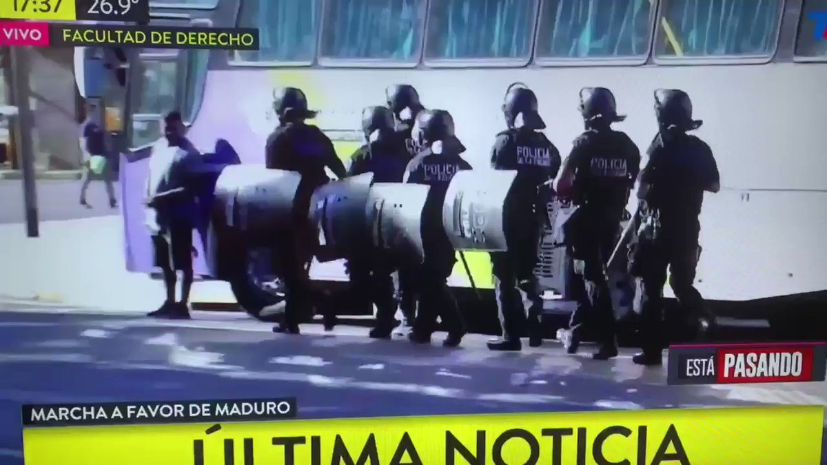 A small group in support of Maduro face off against the police in the vicinity of the Faculty of Law in Buenos Aires Argentina