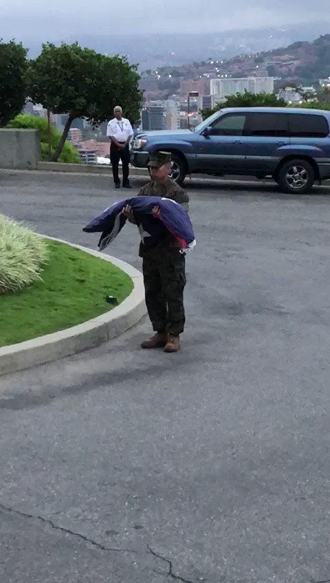 The withdrawal of the American flag from the U.S embassy in Caracas as the remaining diplomatic staff prepare to leave Venezuela   