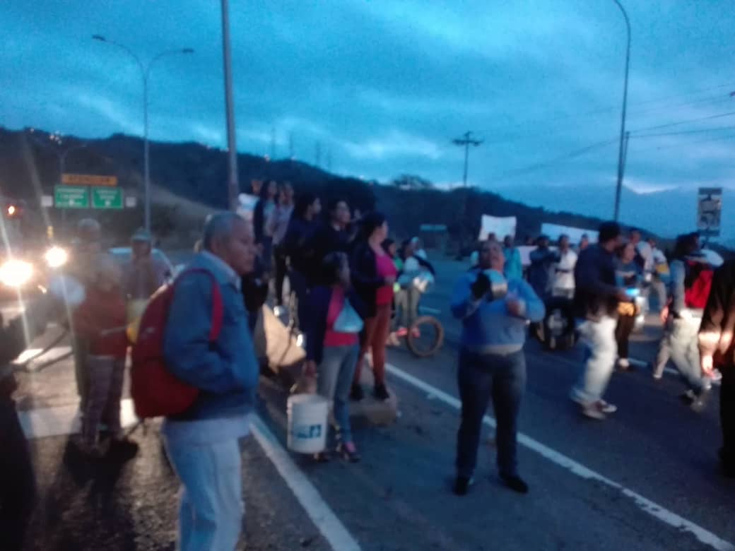 Neighbors from the upper part of La Vega in Caracas protest on the Pan-American Highway against water shortages. 