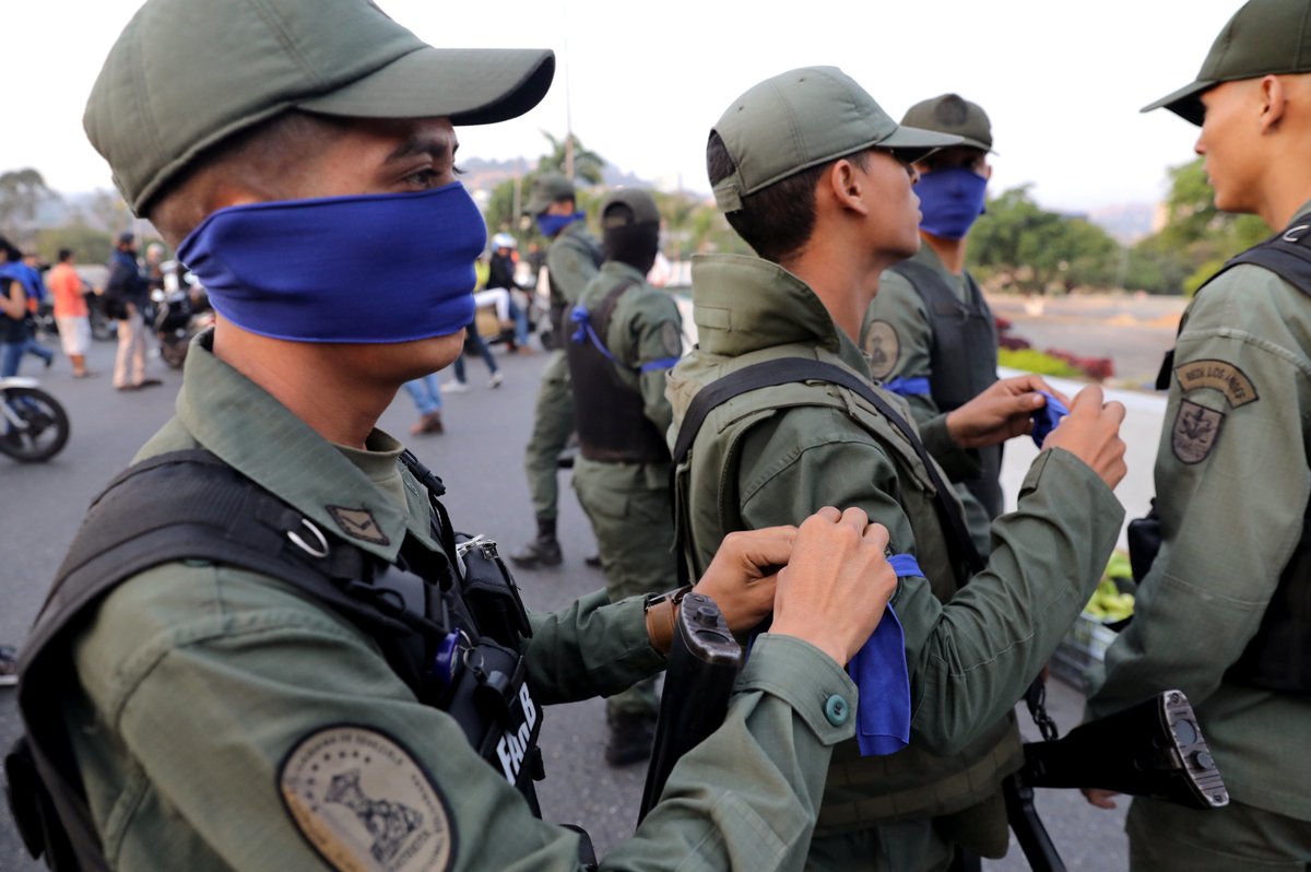 Military loyal to the Acting President @jguaido have been identified with a blue ribbon. Photo: Reuters.
