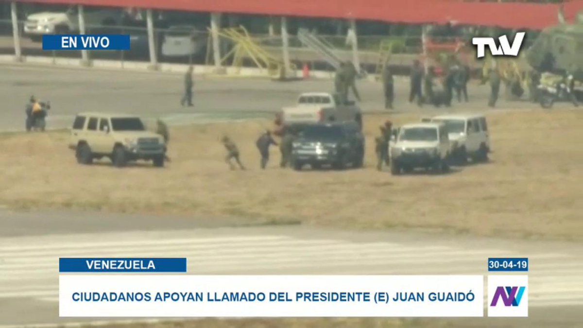 This is the La Carlota Air Base. Movement is observed by military officers in vehicles.