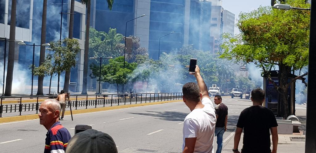 Tear gas grenades being launched near Lido mall in central Caracas