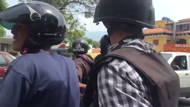 Venezuelan National police fire tear gas at demonstrators in Santa Monica