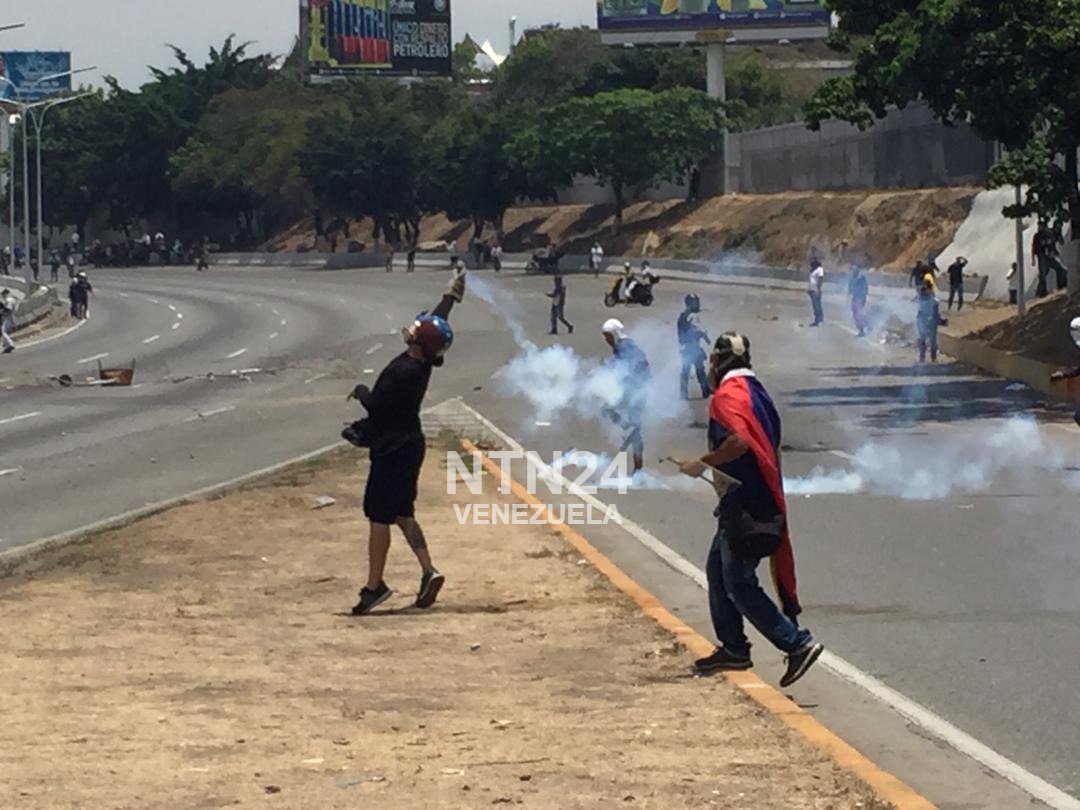 At the area of the La Carlota Air Base, National Guard troops crackdown on the protesters who demand the exit of Maduro