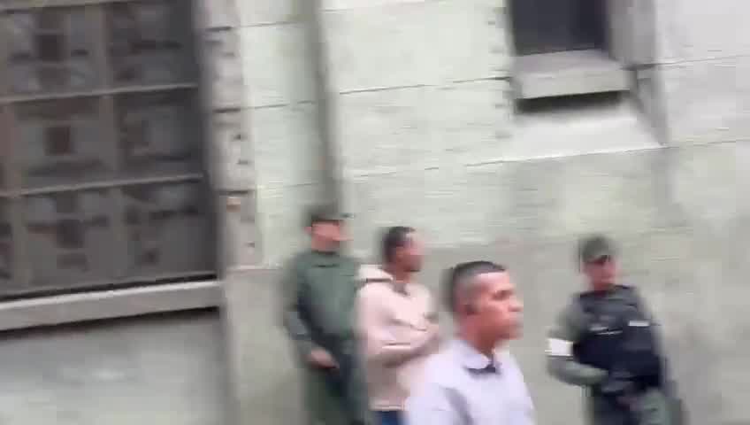 Vladimir Padrino López leaves after meeting with Delcy Rodríguez at the vice presidency